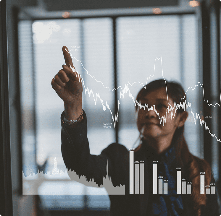 Businesswoman analyzing financial graphs on screen