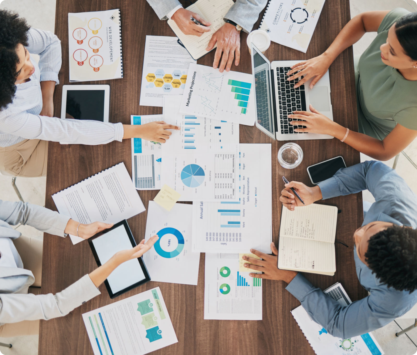 Colleagues discussing financial data and charts