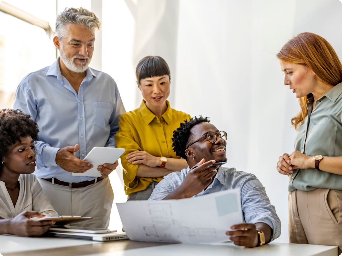 Colleagues engaged in a meeting discussion